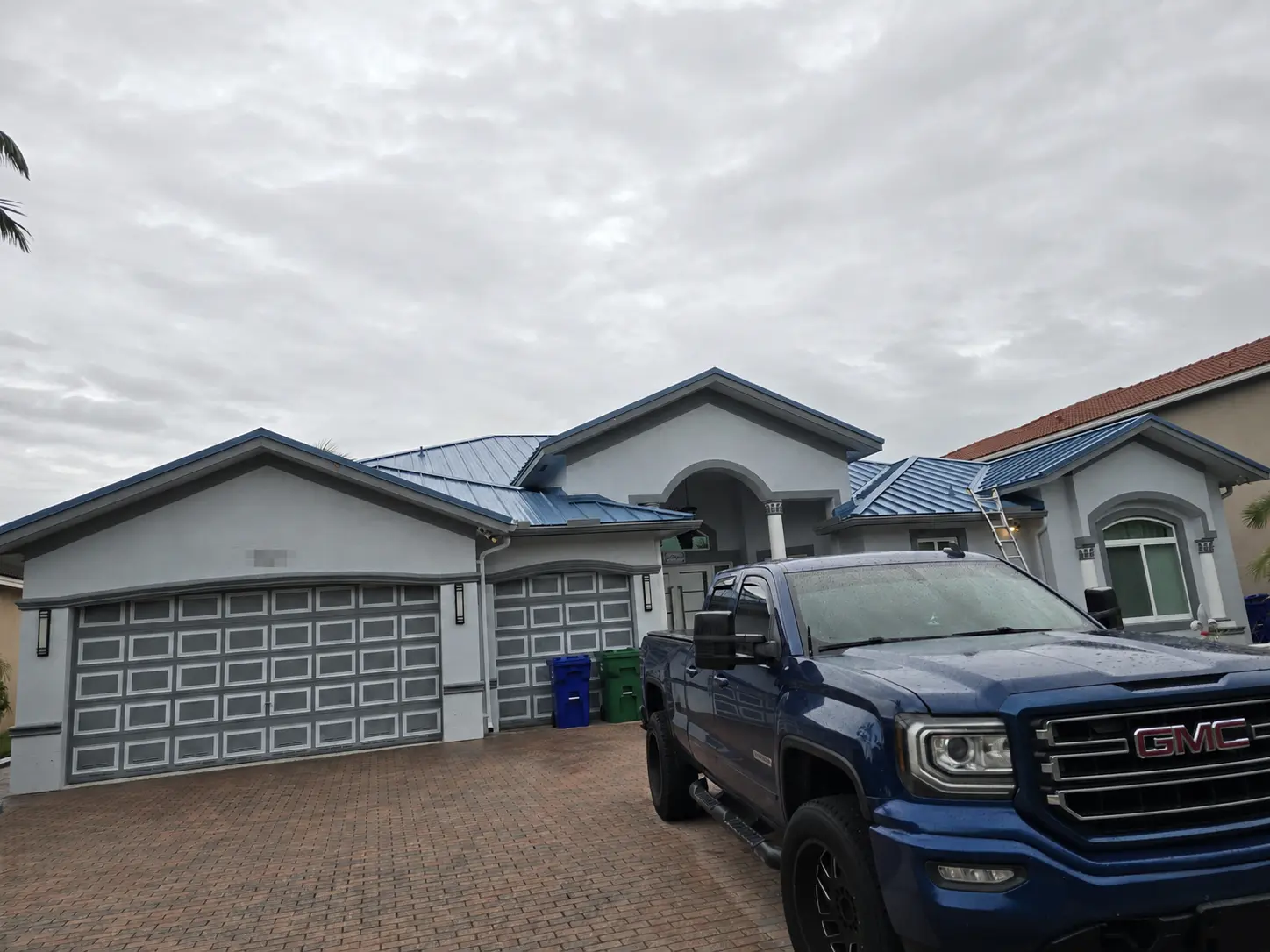 Front view of a Miramar home after its tile roof was replaced with a Regal Blue standing-seam metal roof.