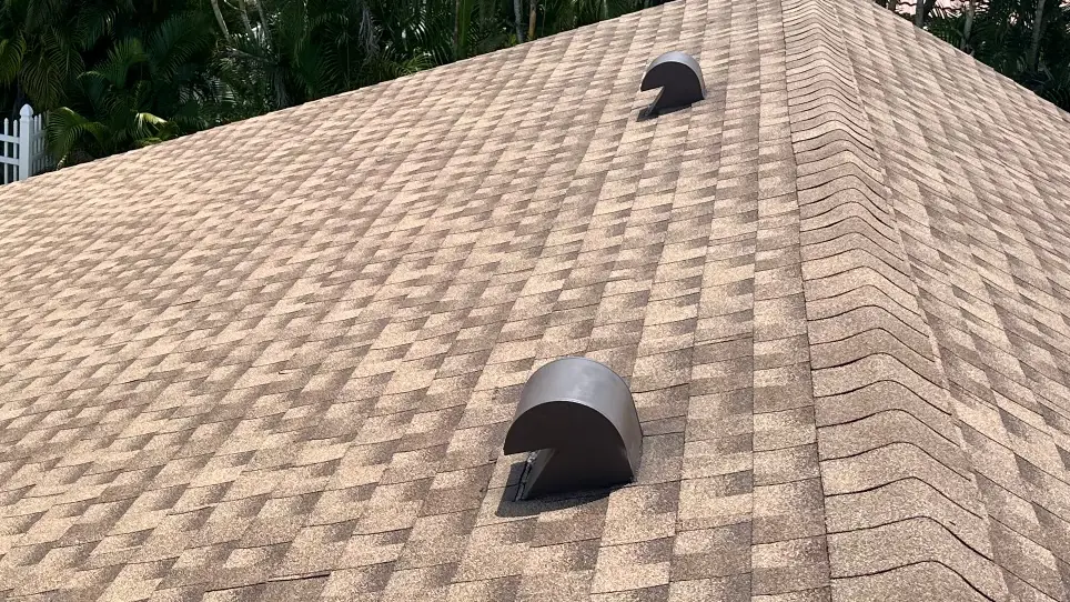Finished Shakewood asphalt shingles across a hip, ridge, and roof vent details in Deerfield Beach, Florida.