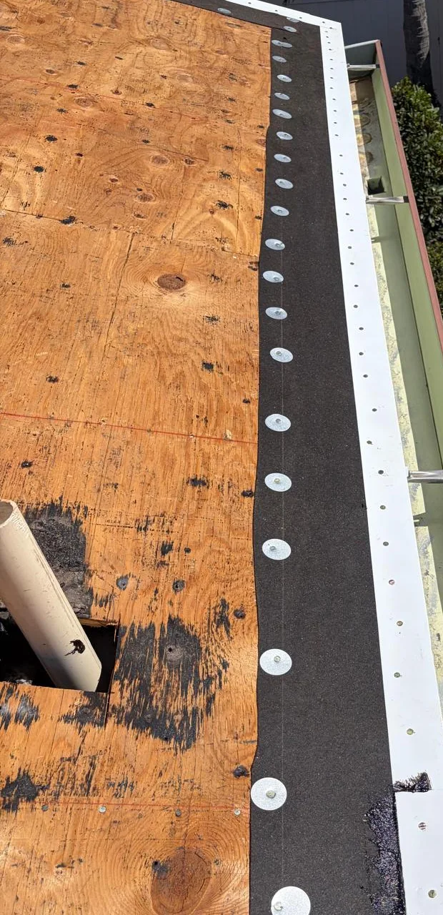 Prepared metal drip edge installed along repaired roof decking in Miramar